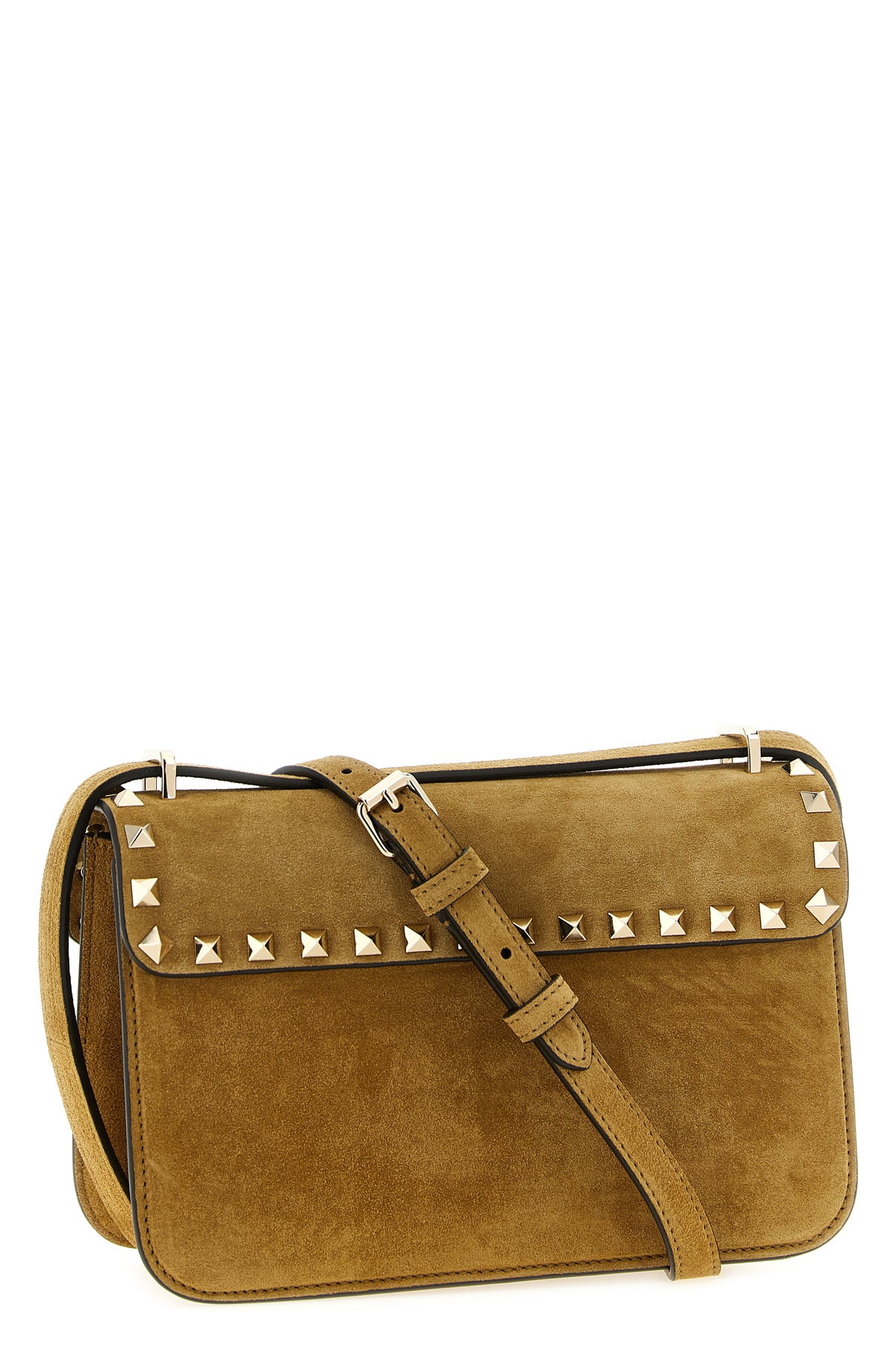 the valentino garavani rockstud small shoulder bag in beige suede stands out f