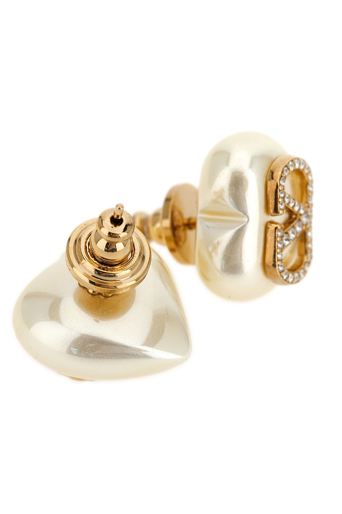 valentino garavani earrings define a romantic and structured aesthetic