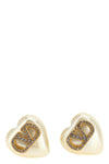 valentino garavani earrings define a romantic and structured aesthetic