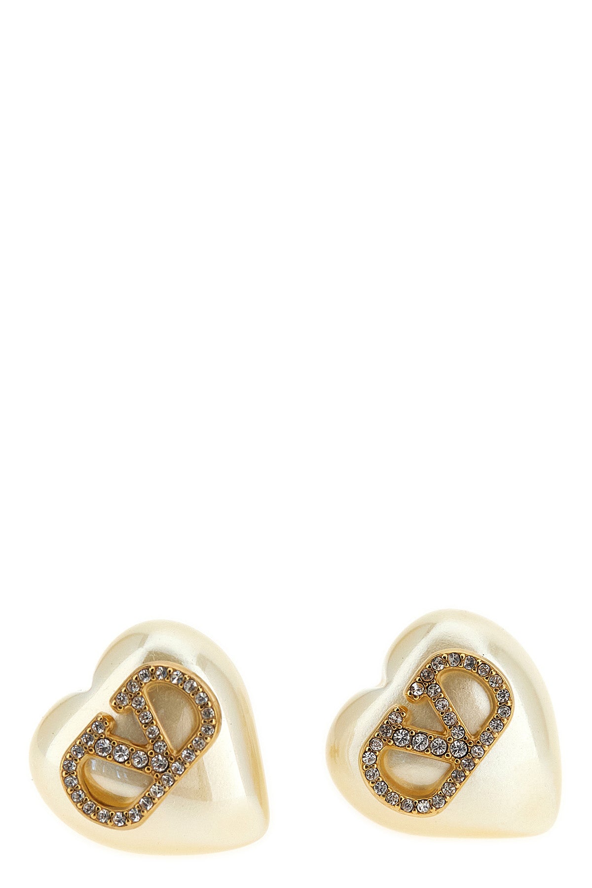 valentino garavani earrings define a romantic and structured aesthetic