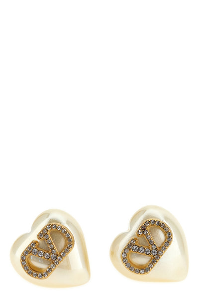 valentino garavani earrings define a romantic and structured aesthetic