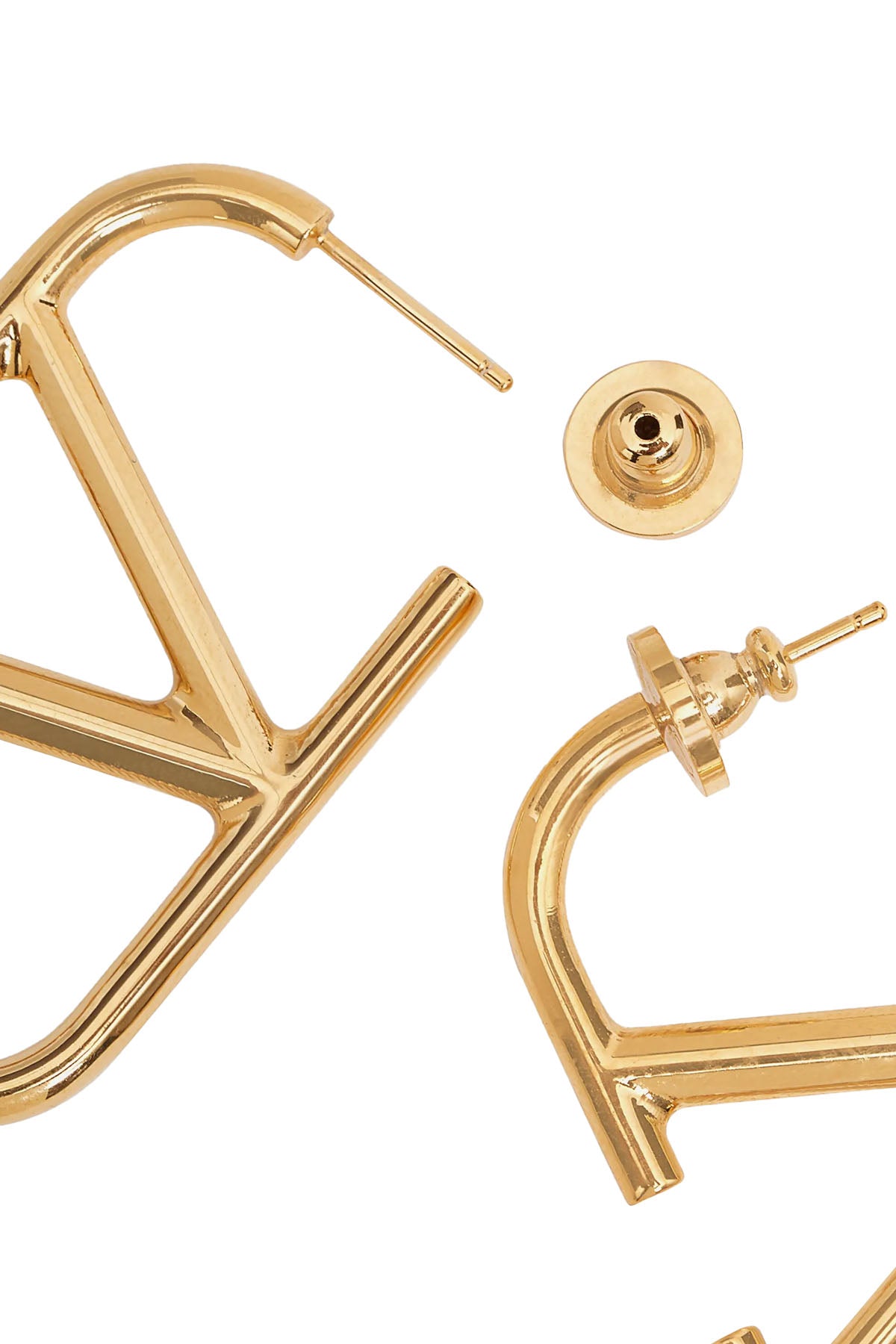 valentino garavani earrings define contemporary elegance through a precise archi