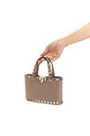 rockstud mini crossbody bag in garnet calfskin