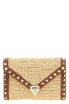 rockstud mini crossbody bag in woven natural raffia