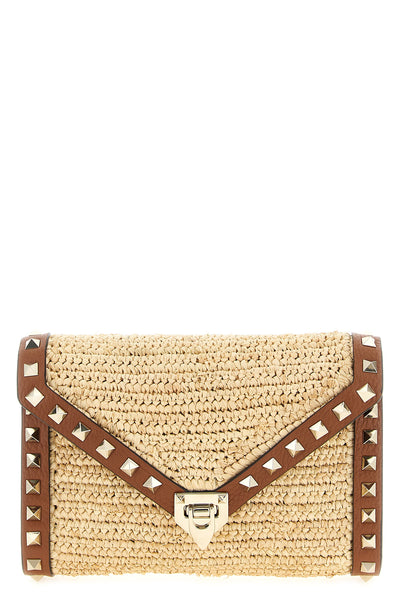 rockstud mini crossbody bag in woven natural raffia
