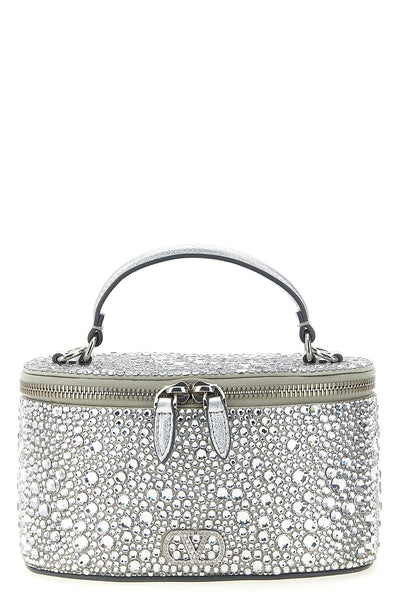 the valentino garavani vanity mini handbag reinterprets the classic silhouette
