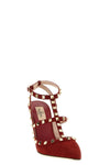 the valentino garavani rockstud pumps define the aesthetics of the maison throug