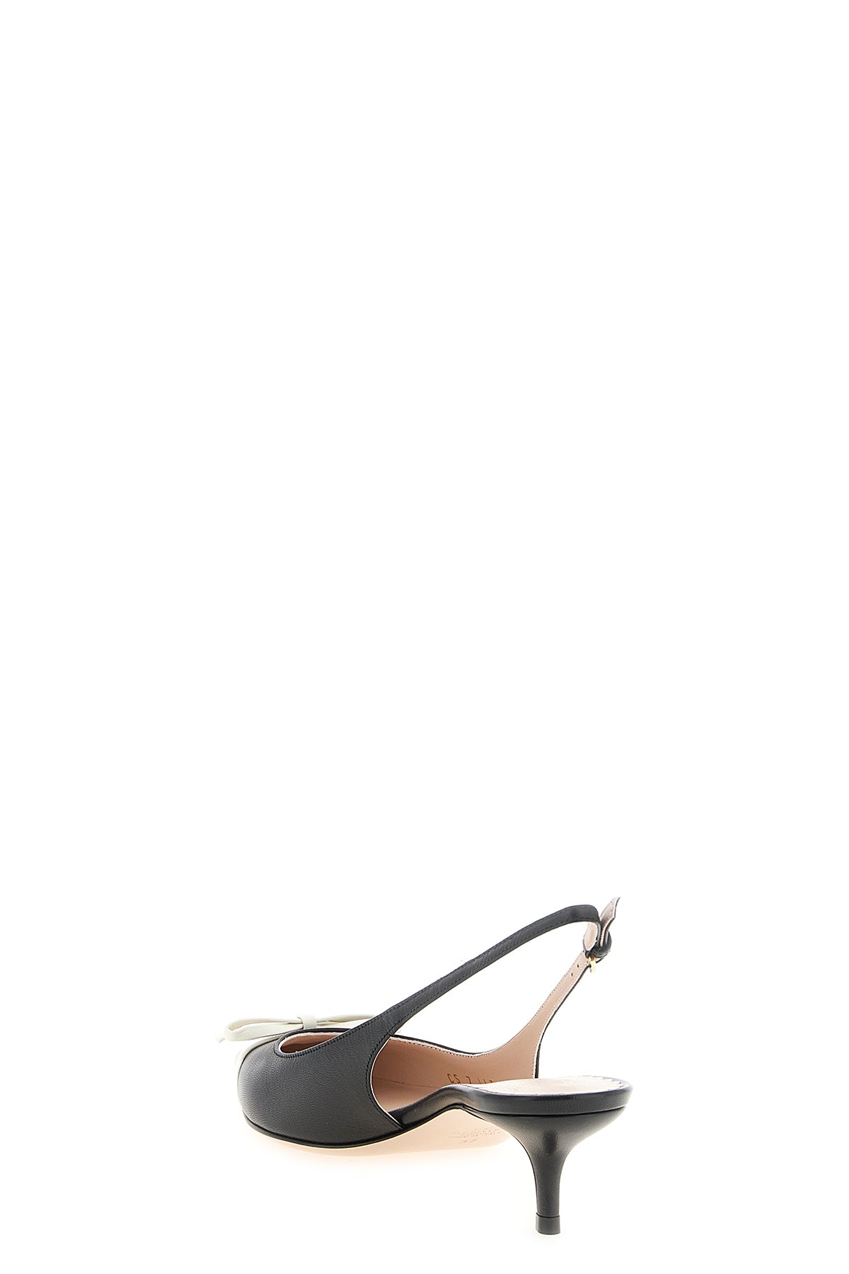 the valentino garavani slingback shoe defines a tapered model through a construc
