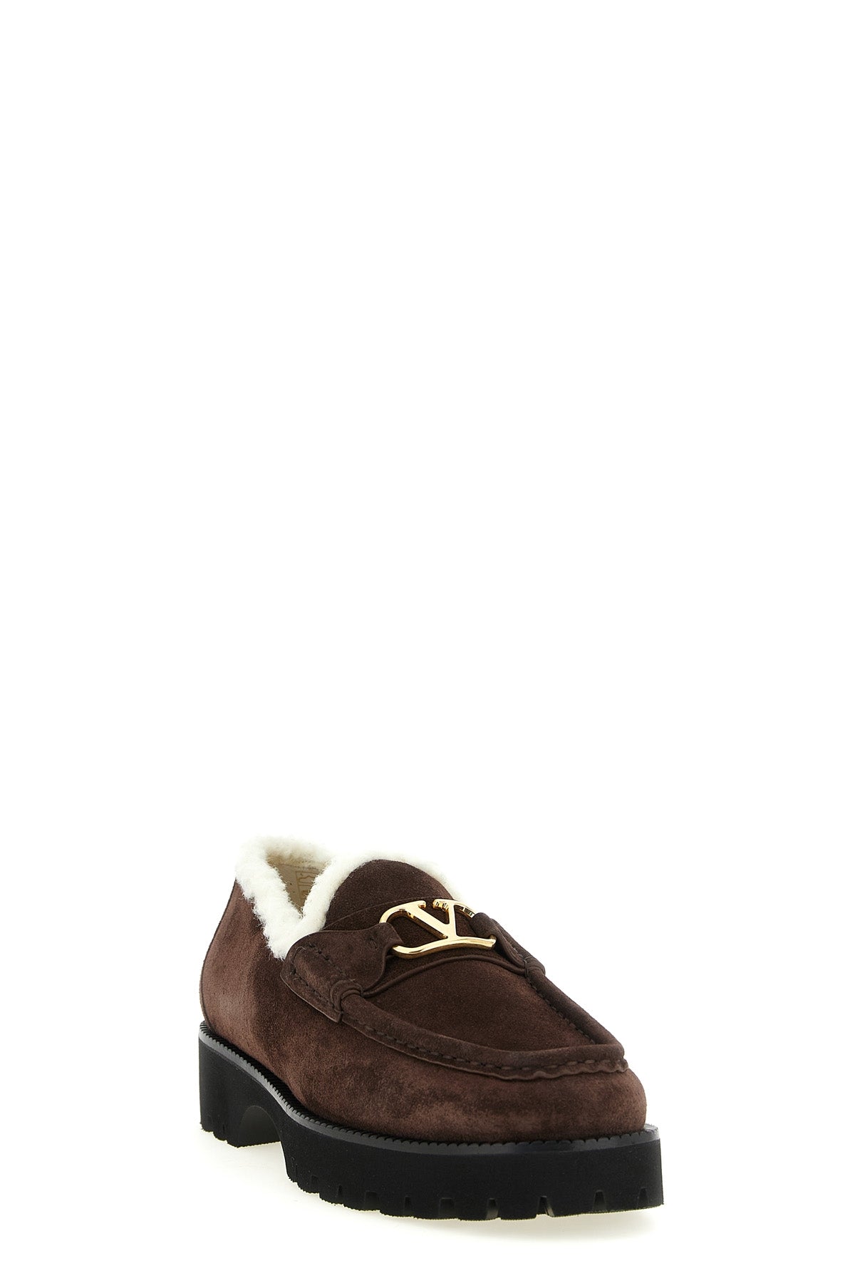 valentino garavani loafers redefine everyday elegance through a structured silho