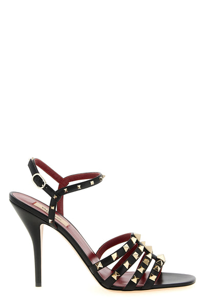 valentino garavani sandals define a bold silhouette through a construction in fi