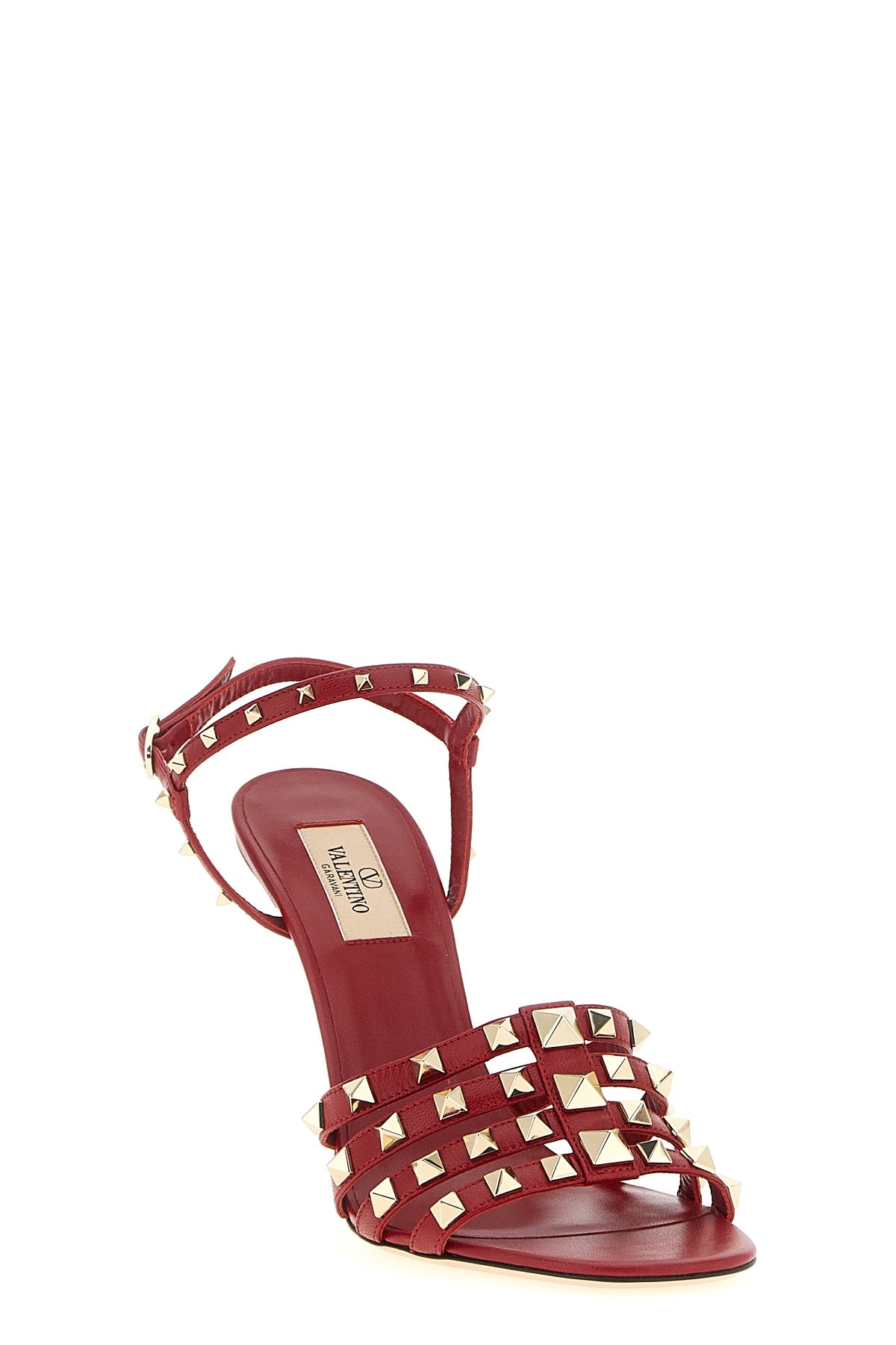 the valentino garavani rockstud high-heeled sandal defines a bold shape through