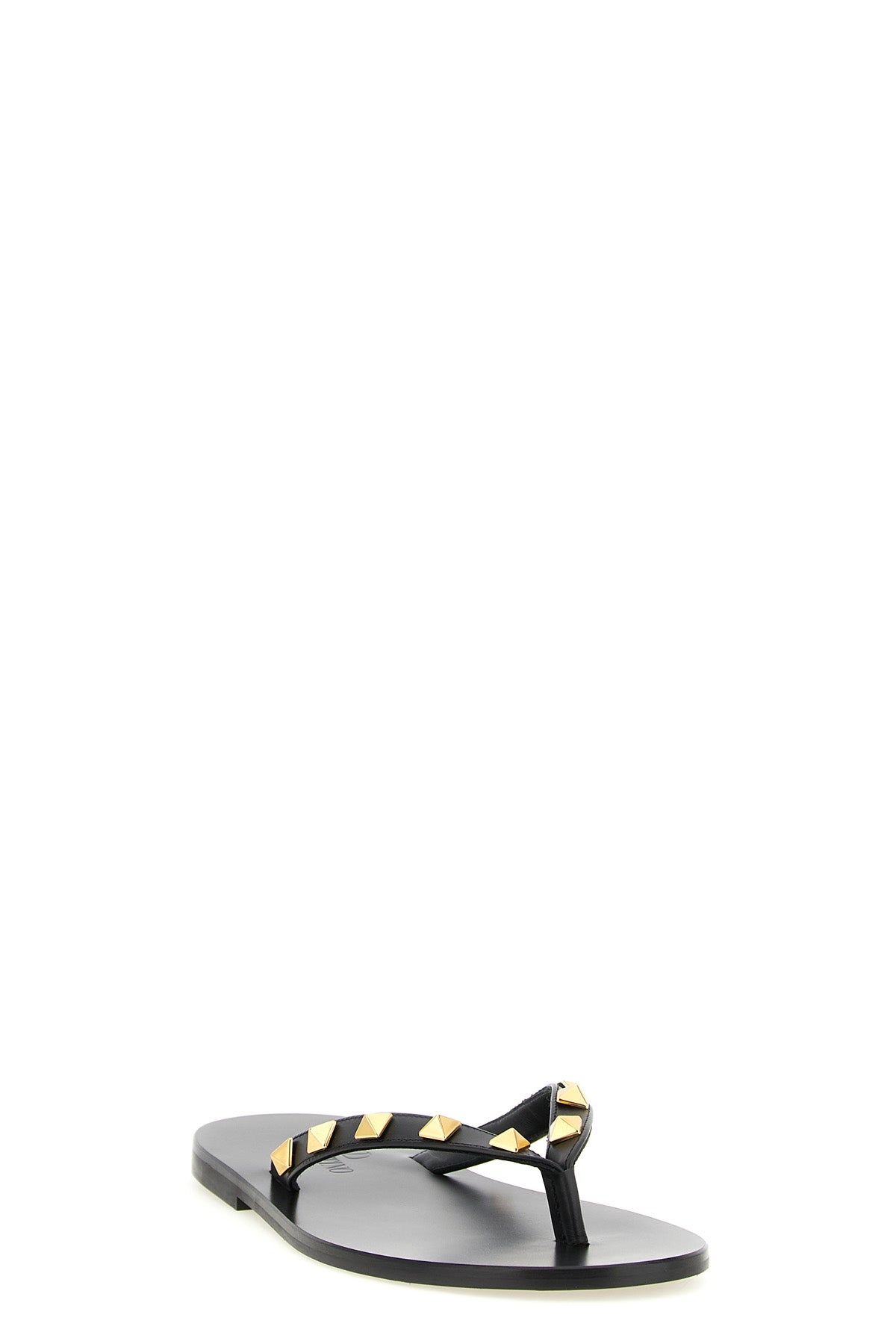 the valentino garavani rockstud thong sandals define an essential aesthetic th
