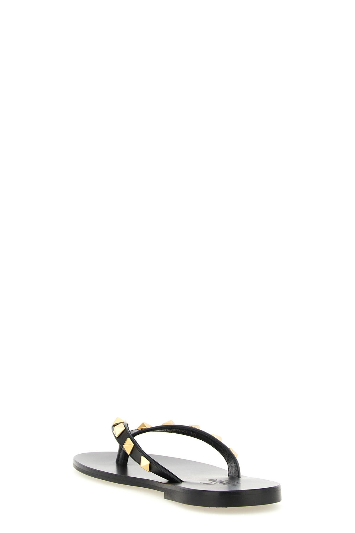 the valentino garavani rockstud thong sandals define an essential aesthetic th