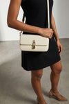 the furla iride s crossbody bag in textured calf leather embodies a structured