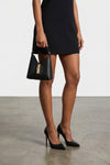 the furla iride mini handbag is made of textured black calf leather