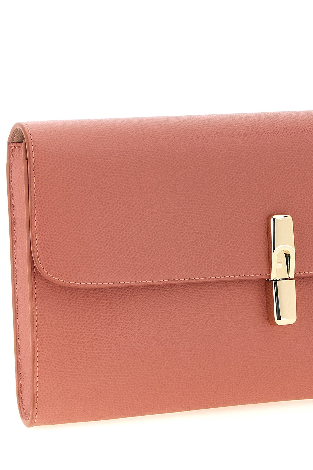 the furla iride clutch defines a minimalist aesthetic through a flat and structu