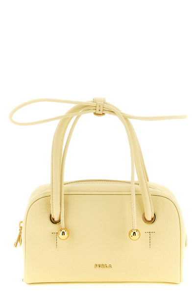 the furla poppy mini handbag redefines the codes of leather goods through a st