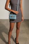 the furla moonlight mignon handbag defines a compact and structured silhouette
