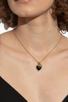 the dolce & gabbana heart logo necklace is distinguished by a thin gold-finish