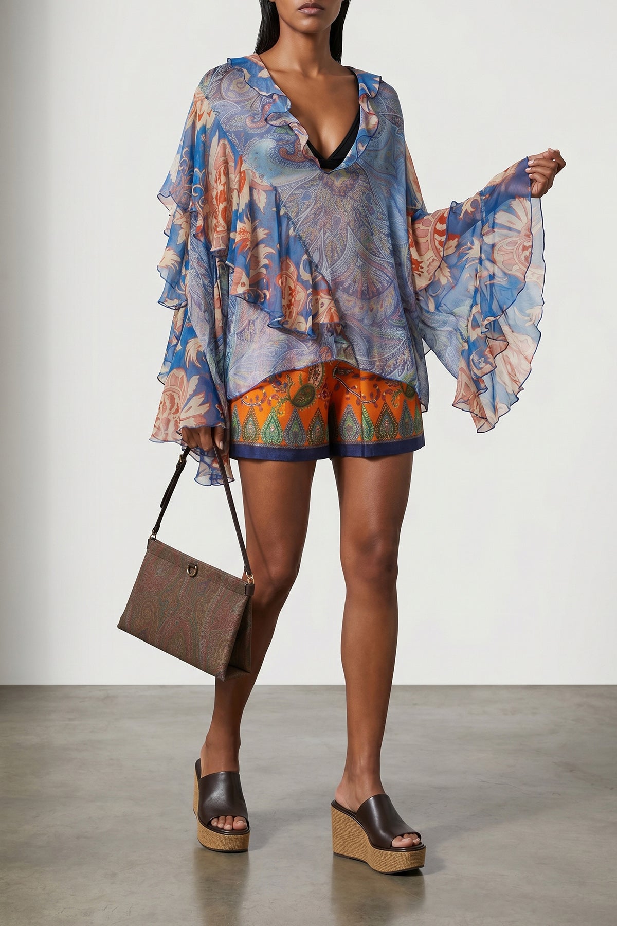 talk mini clutch made in the iconic paisley-pattern jacquard fabric