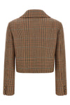 the cropped etro blazer redefines traditional tailoring through a shortened and