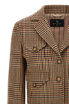 the cropped etro blazer redefines traditional tailoring through a shortened and