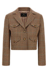 the cropped etro blazer redefines traditional tailoring through a shortened and