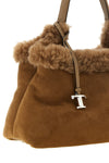 the small handbag tods embodies a timeless material elegance