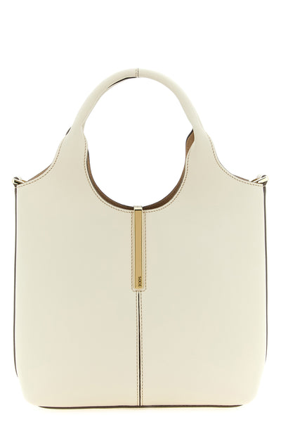 the tods mini tote bag is made of soft cream calf leather