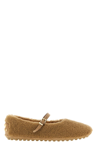 the tods ballet flats redefines the classic silhouette through a mry-jane model