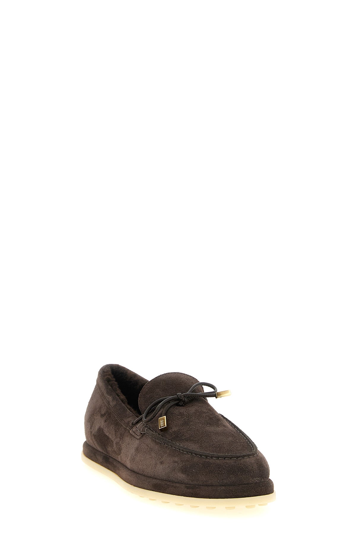 tods moccasins redefine winter elegance through meticulous construction