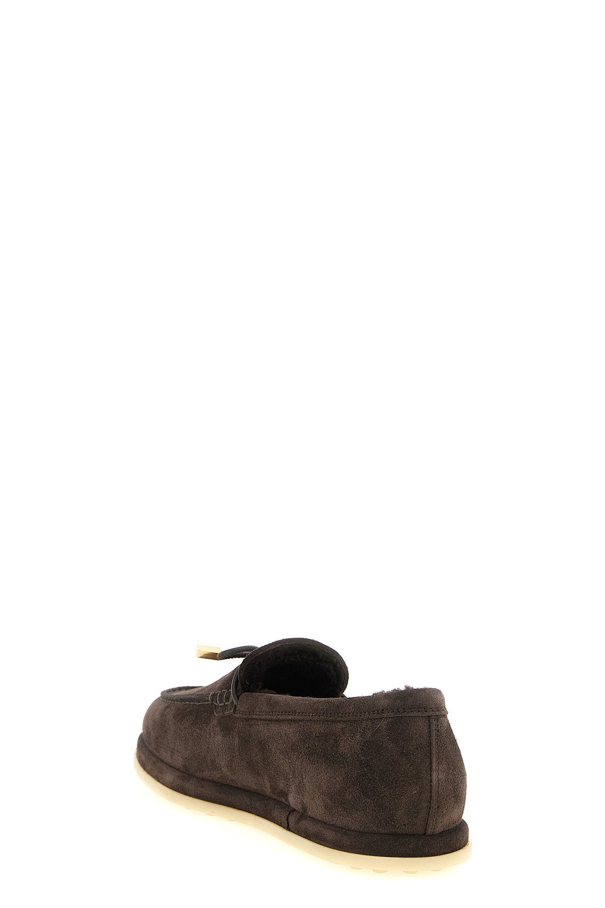 tods moccasins redefine winter elegance through meticulous construction