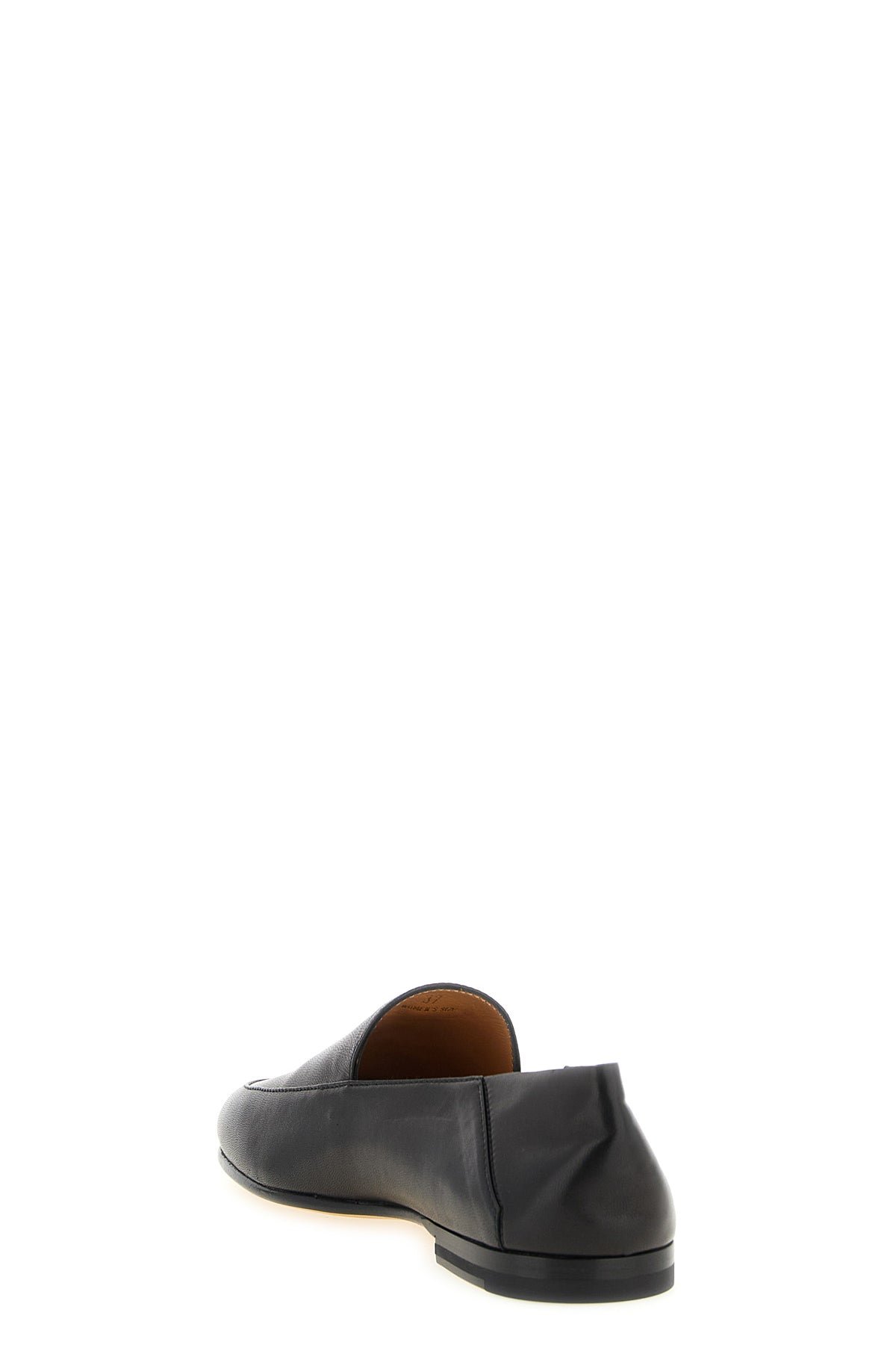 the slipper loafer tods in soft black nappa leather represents an impeccable sy