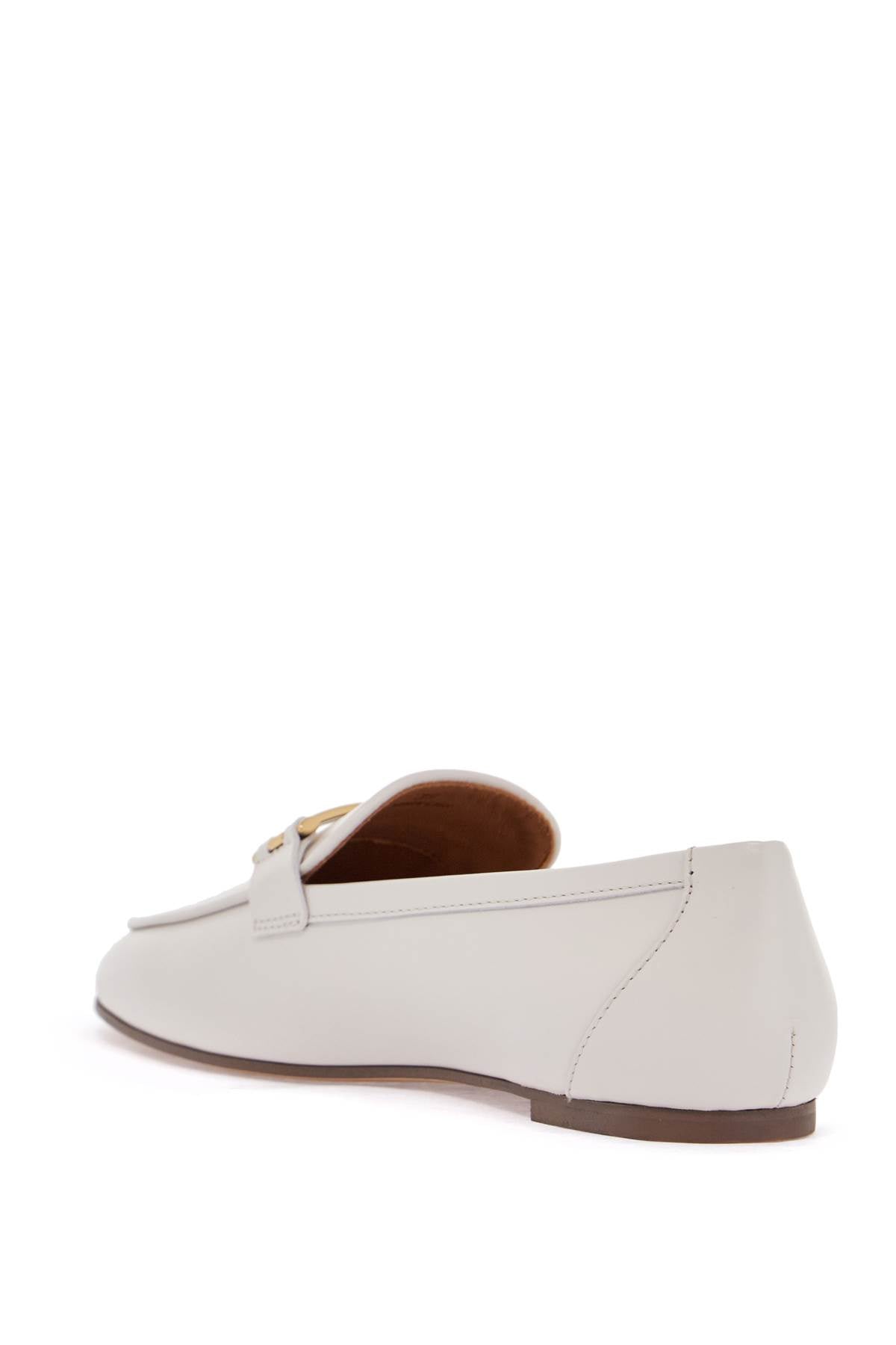 white calfskin moccasin with gold bar and velcro closure