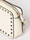 rockstud grained leather clutch