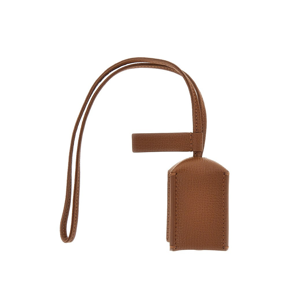 grained leather charm with logo plate